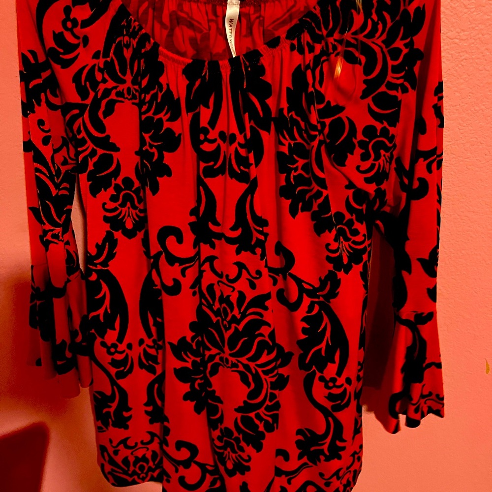 Beautiful bright orange and black dress with bell sleeves